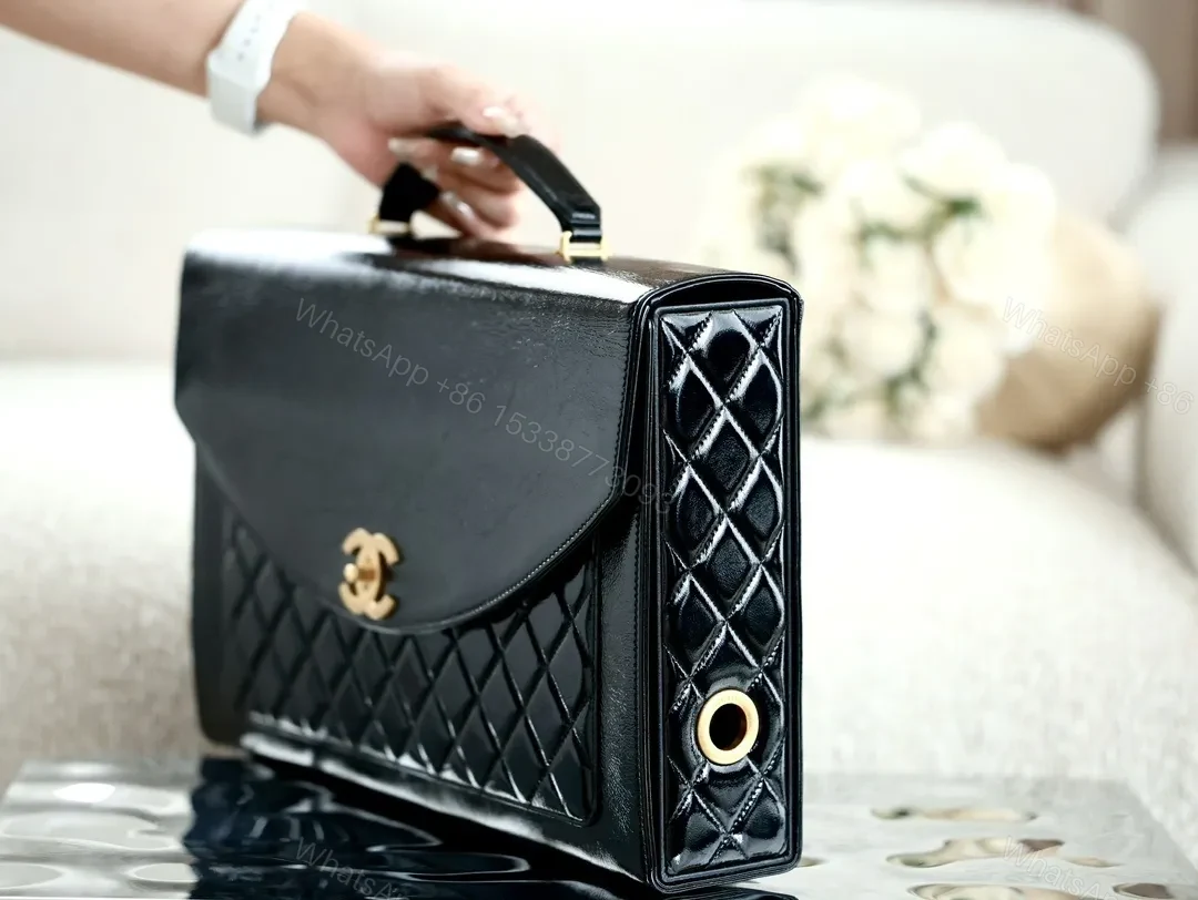 View 2 of Compact Quilted Leather Handbag with Gold Hardware