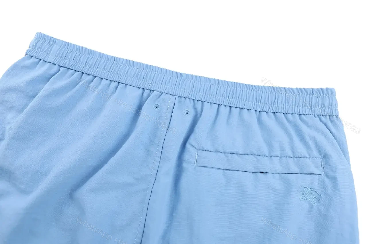 View 10 of Light Blue Cotton-Blend Swim Shorts with Burberry-Check Side Strips