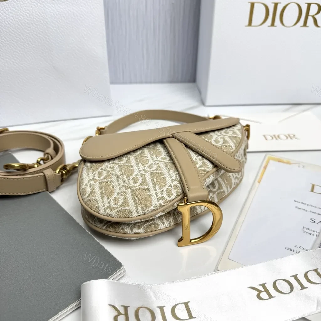 View 3 of Beige Leather-Trim Mini Saddle Bag, Monogram Canvas, Crossbody