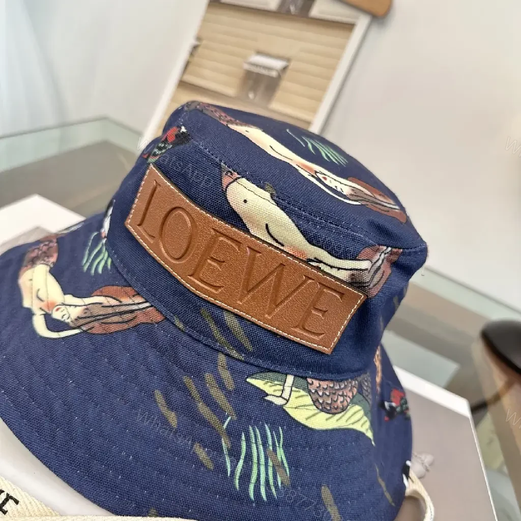 View 4 of Navy Floral Canvas Bucket Hat with Leather Brand Patch
