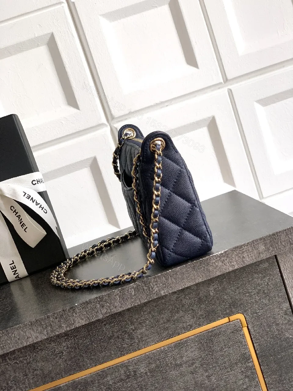View 4 of Navy Quilted Crossbody: Gold-Emblem, Compact Luxury Bag