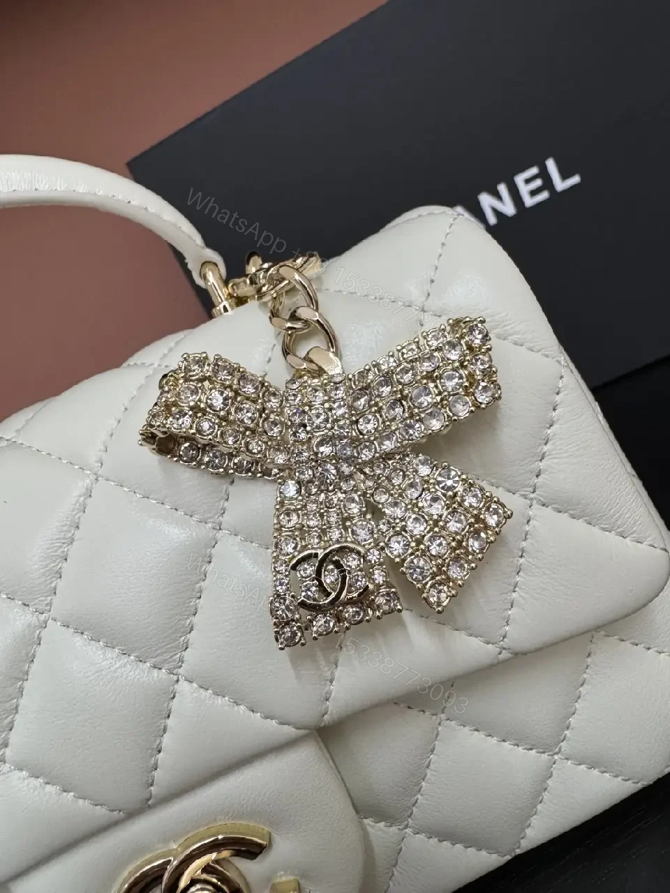 View 6 of White Quilted Luxe Handbag with Diamond Bow Charm - Satchel Style