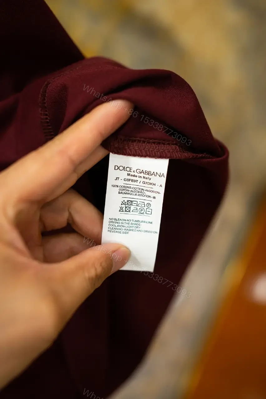 View 9 of Burgundy Short-Sleeve Crewneck T-Shirt with Black Logo Emblem