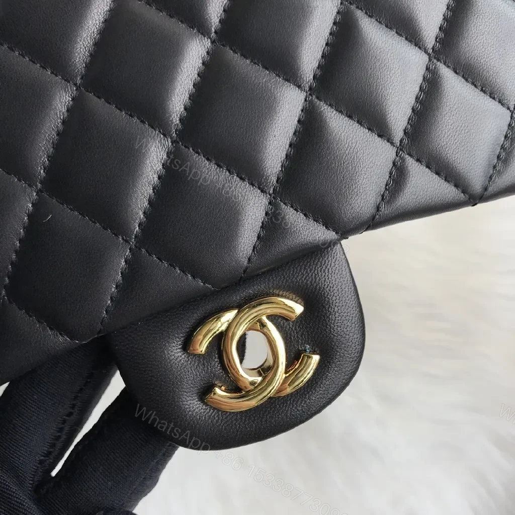 View 9 of Quilted Black Handbag with Gold Clasp – Luxe Chic Style