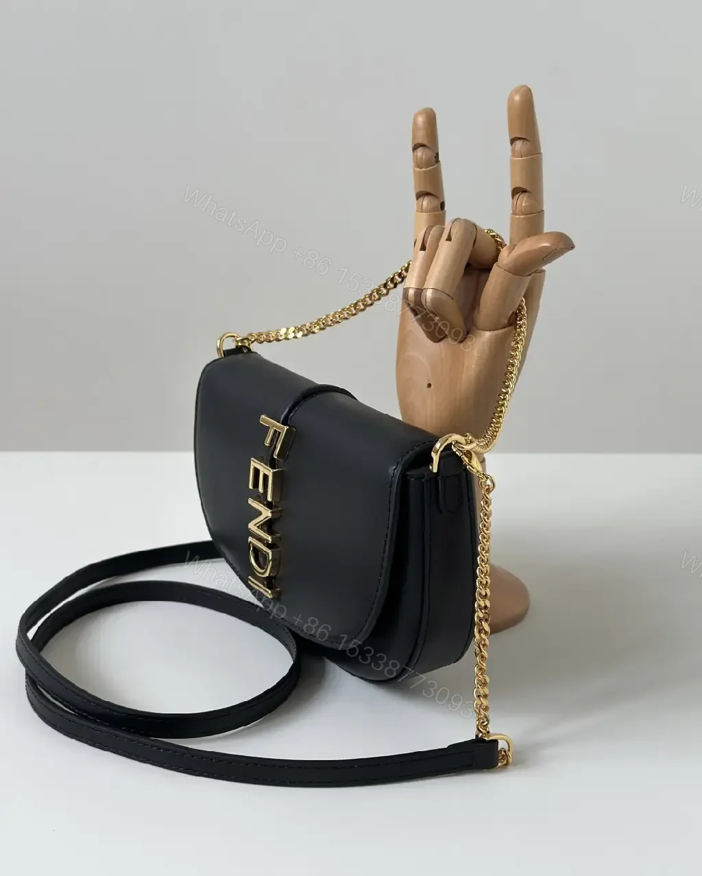 View 5 of Chic Black Leather Shoulder Bag with Gold Hardware, Compact Luxury