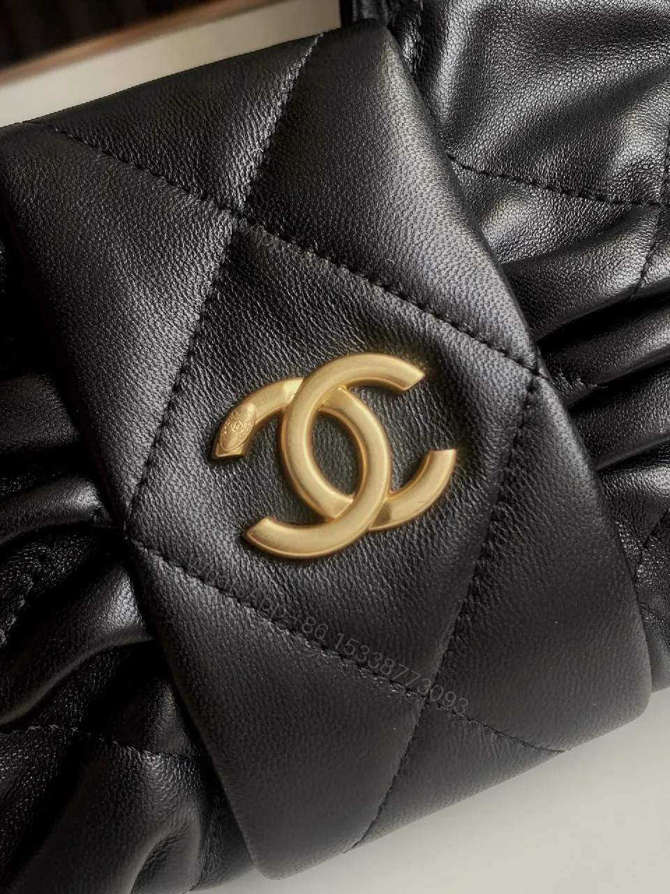 View 4 of Quilted Mini Bag: Black, Satin-like, Chic, Gold Hardware, Clutch