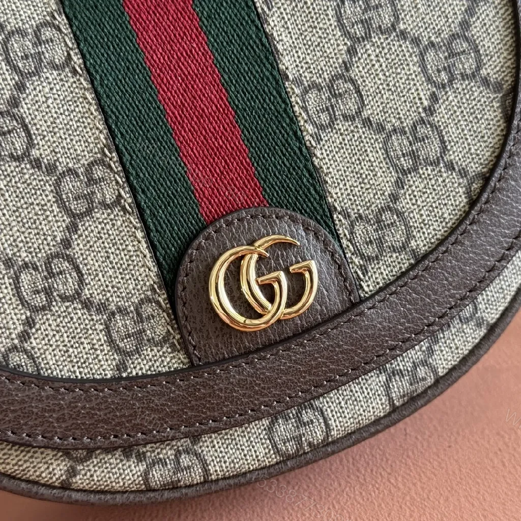 View 2 of Green Canvas Saddle Bag: Luxe Crossbody with Web Stripe and Gold Hardware