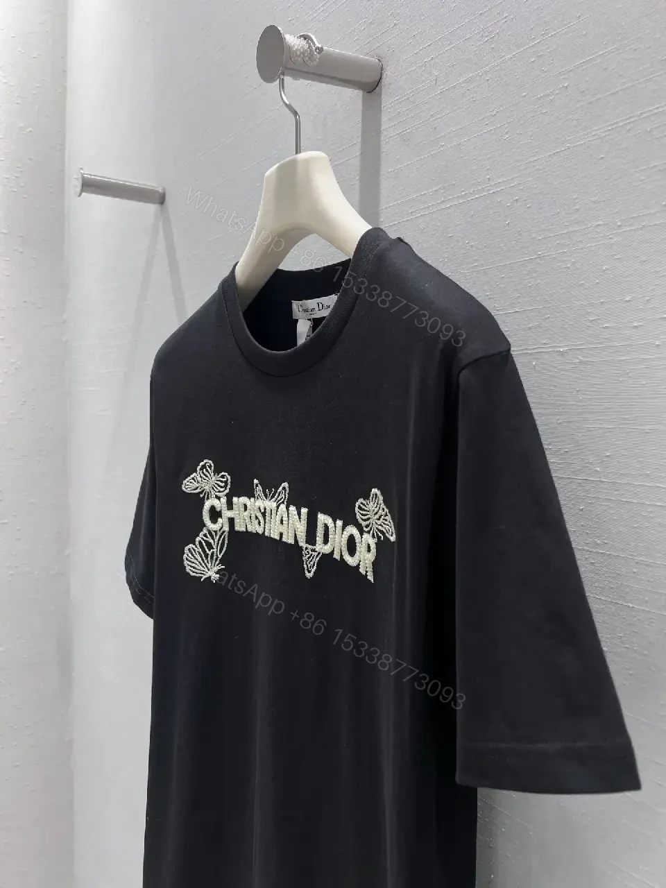 View 7 of Black Cotton Tee with Subtle Embroidered Logo - Luxury Everyday Wear