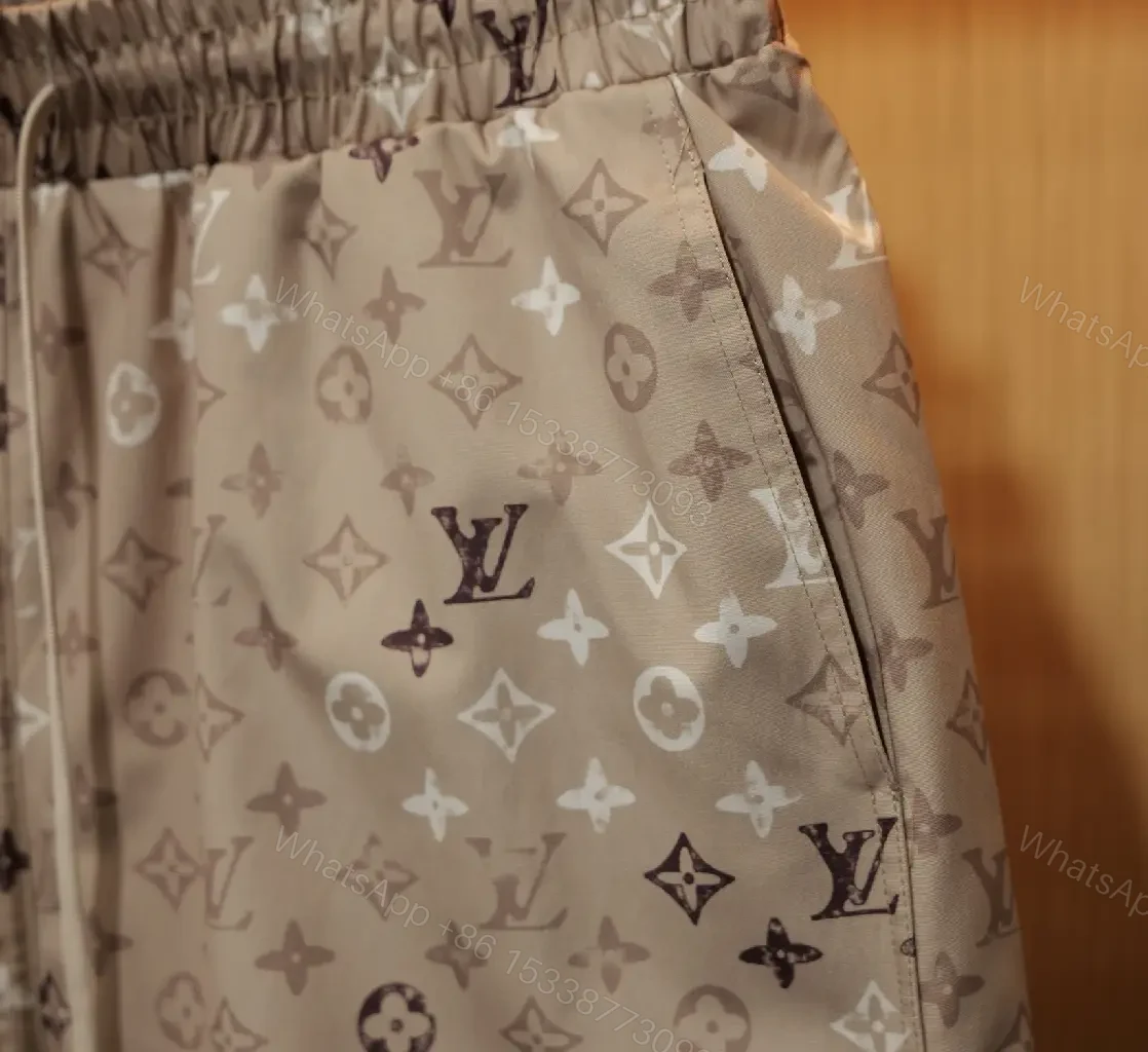 View 5 of Beige Monogram Print Drawstring Swim Shorts