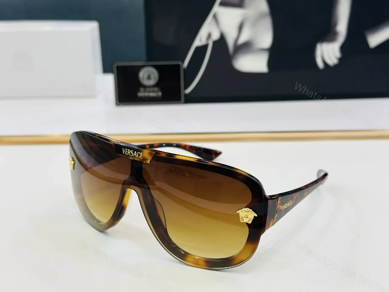 View 8 of Black Gloss Shield Sunglasses with Gold Emblems, Oversized Style