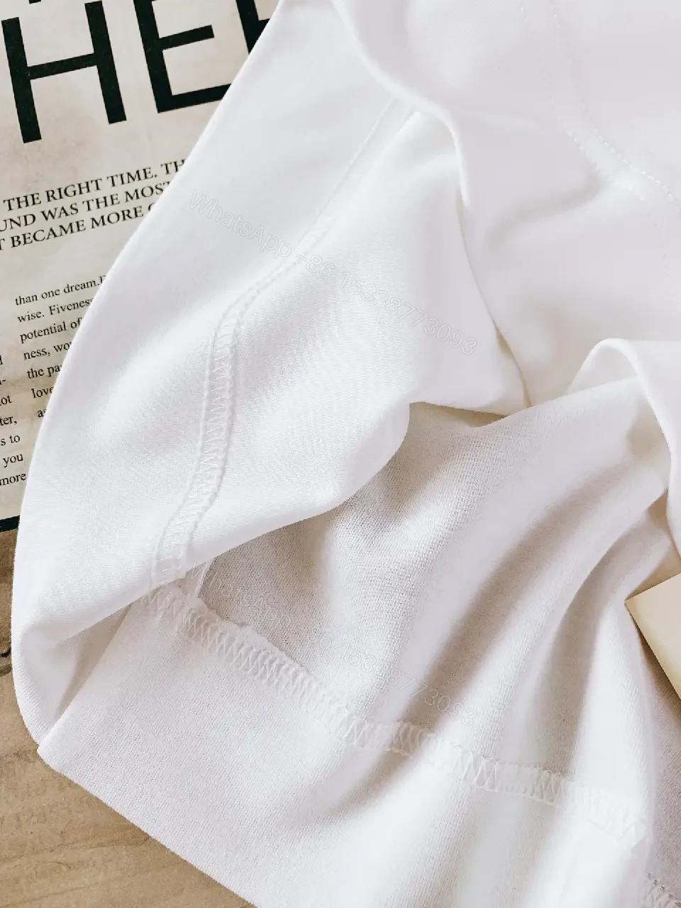 View 6 of Minimalist White Cotton Tee with Subtle Luxury Detail