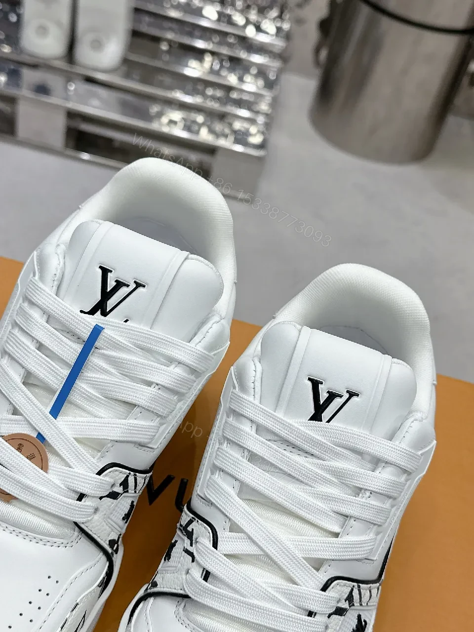 View 2 of White Leather Sneaker, Monogram Motif, Luxe Street Style, Designer Flair, Sneaker