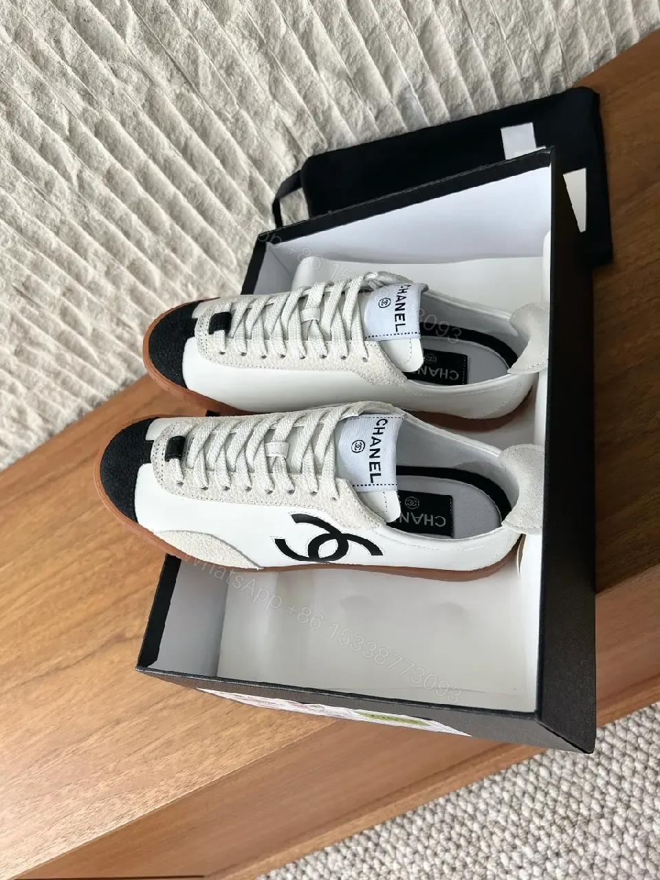 View 7 of Chic Monochrome Leather-Accent Luxury Sneaker, Low-Top