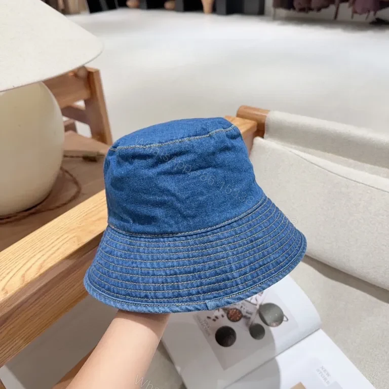 View 2 of Denim CELINE Lettering Bucket Hat â€“ Casual Luxury Sunglow Style