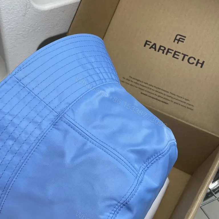View 7 of Blue Prada Bucket Hat: Luxe Nylon, Sun-Protection, Packable