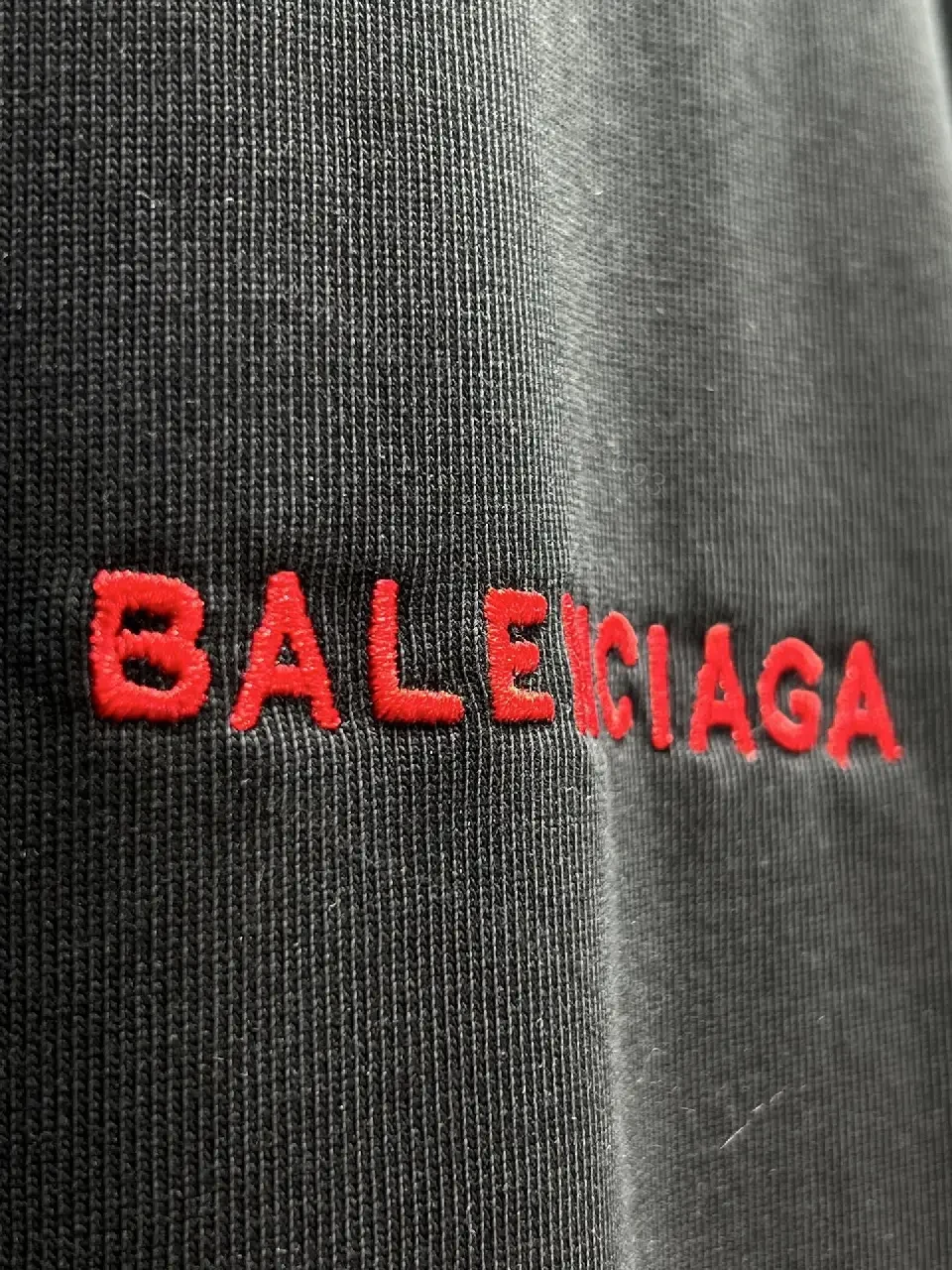 View 4 of Black Cotton Crewneck Tee with Subtle Red Logo Embroidery