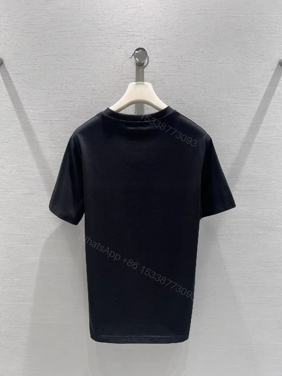View 6 of Black Cotton Tee with Subtle Embroidered Logo - Luxury Everyday Wear