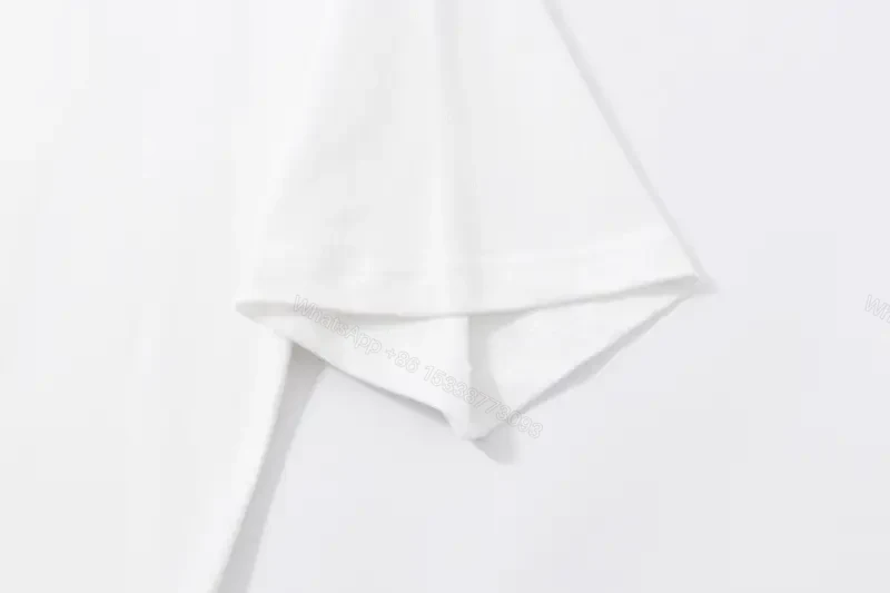 View 10 of Minimalist White Cotton Tee - Subtle Logo, Modern Luxe