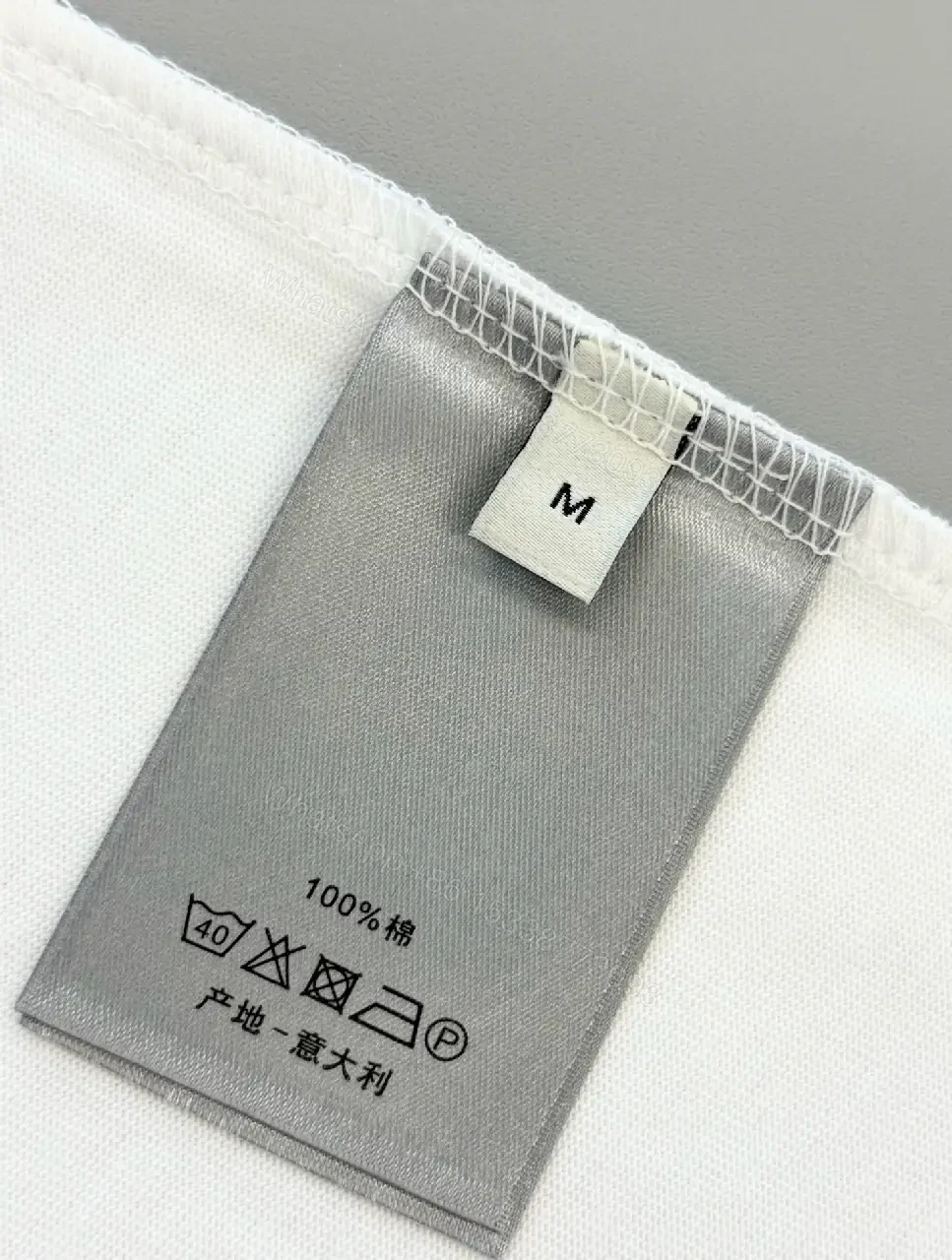 View 11 of Minimal White Tee with Bold Logo Luxury Graphic Tee
