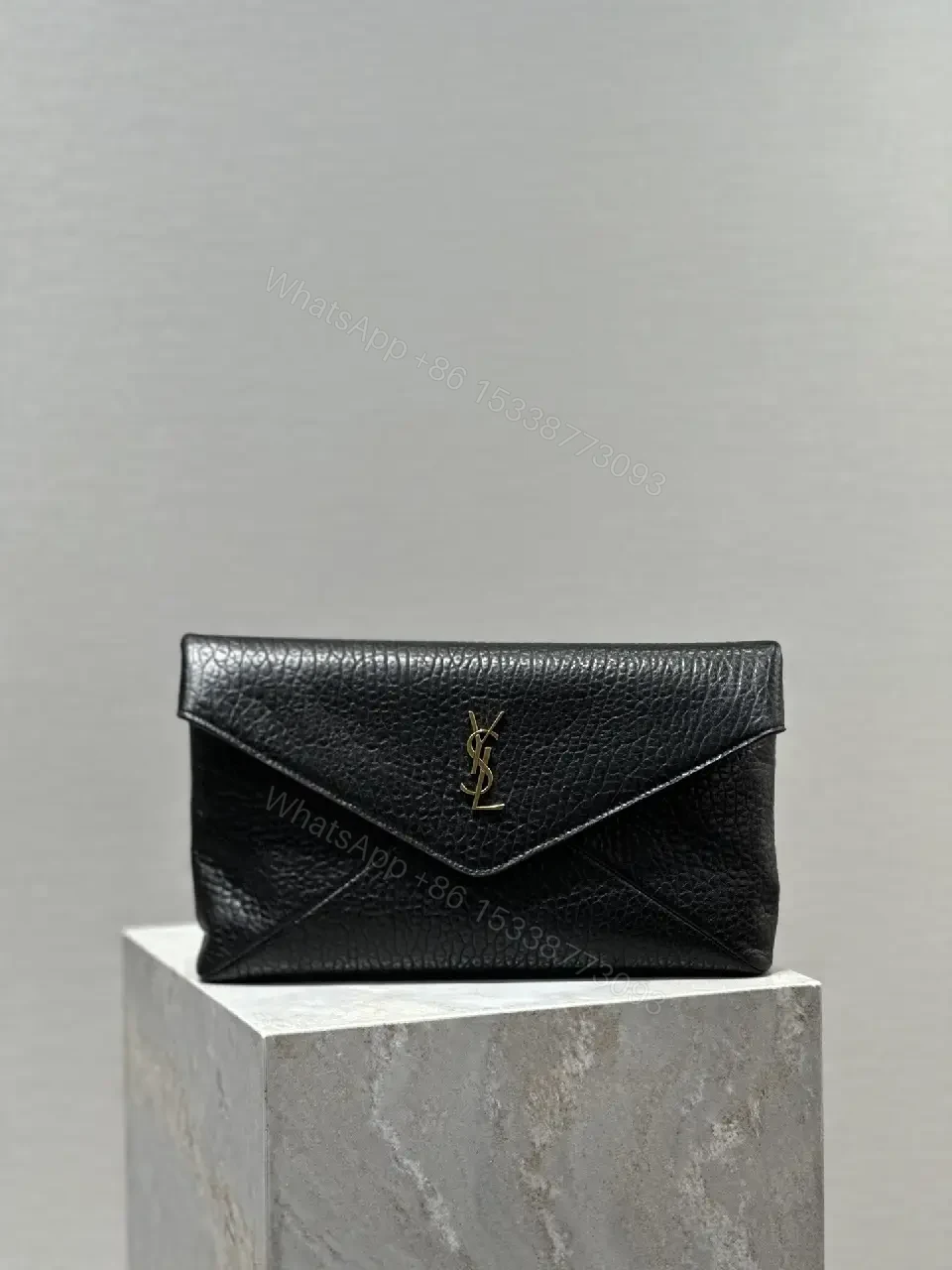 Compact Black Leather Envelope Bag with Gold Logo — view 1