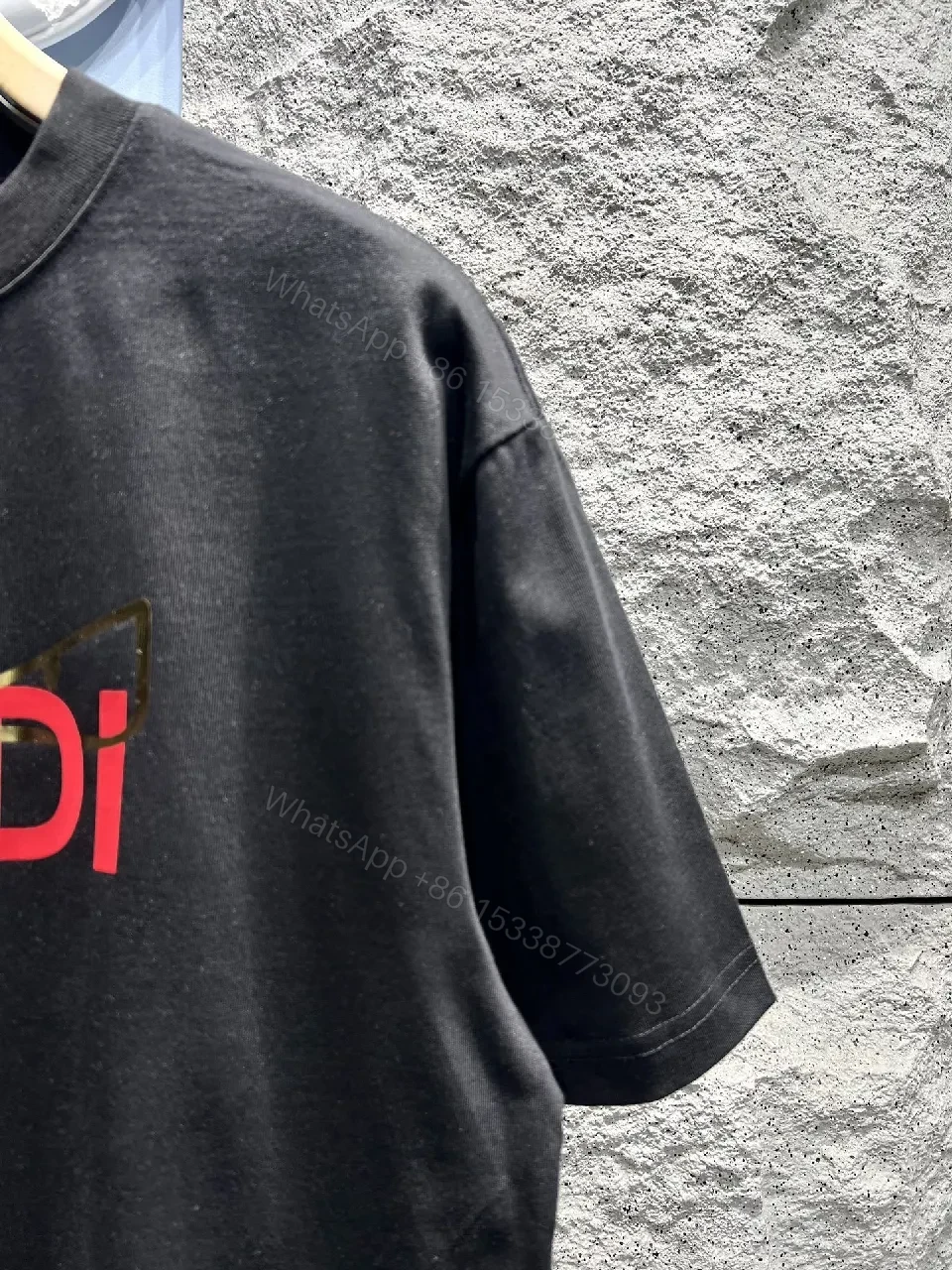 View 8 of Bold Black Tee with Red Fendi Logo Film-Glow