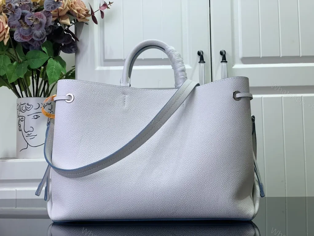 View 3 of Pebbled Leather Tote: LV Emblem, Structured, Spacious Carrier