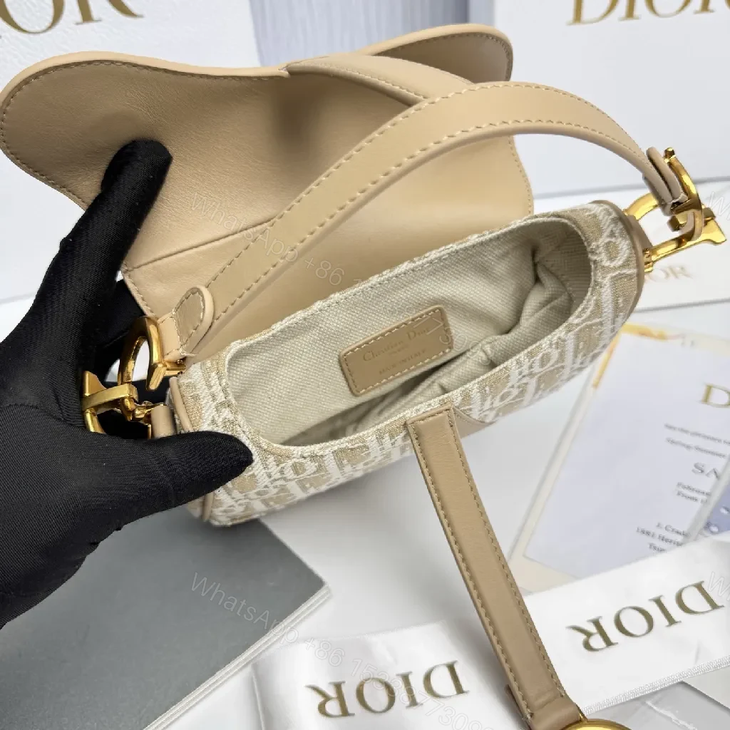 View 6 of Beige Leather-Trim Mini Saddle Bag, Monogram Canvas, Crossbody