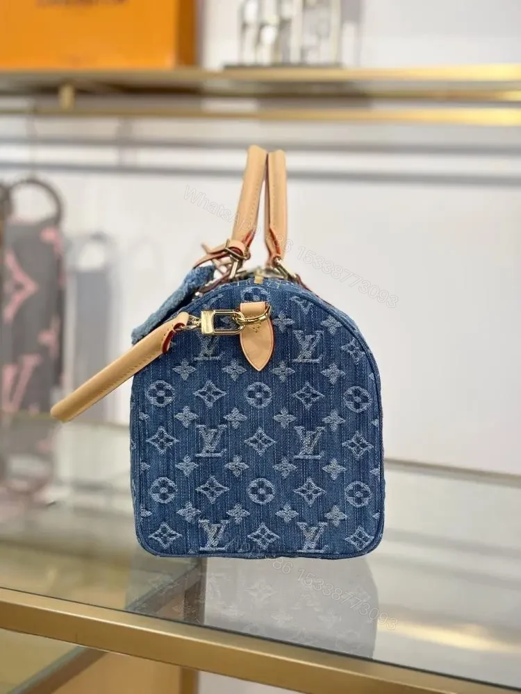 View 8 of Louis Vuitton Monogram Denim Speedy Soft 30 bag