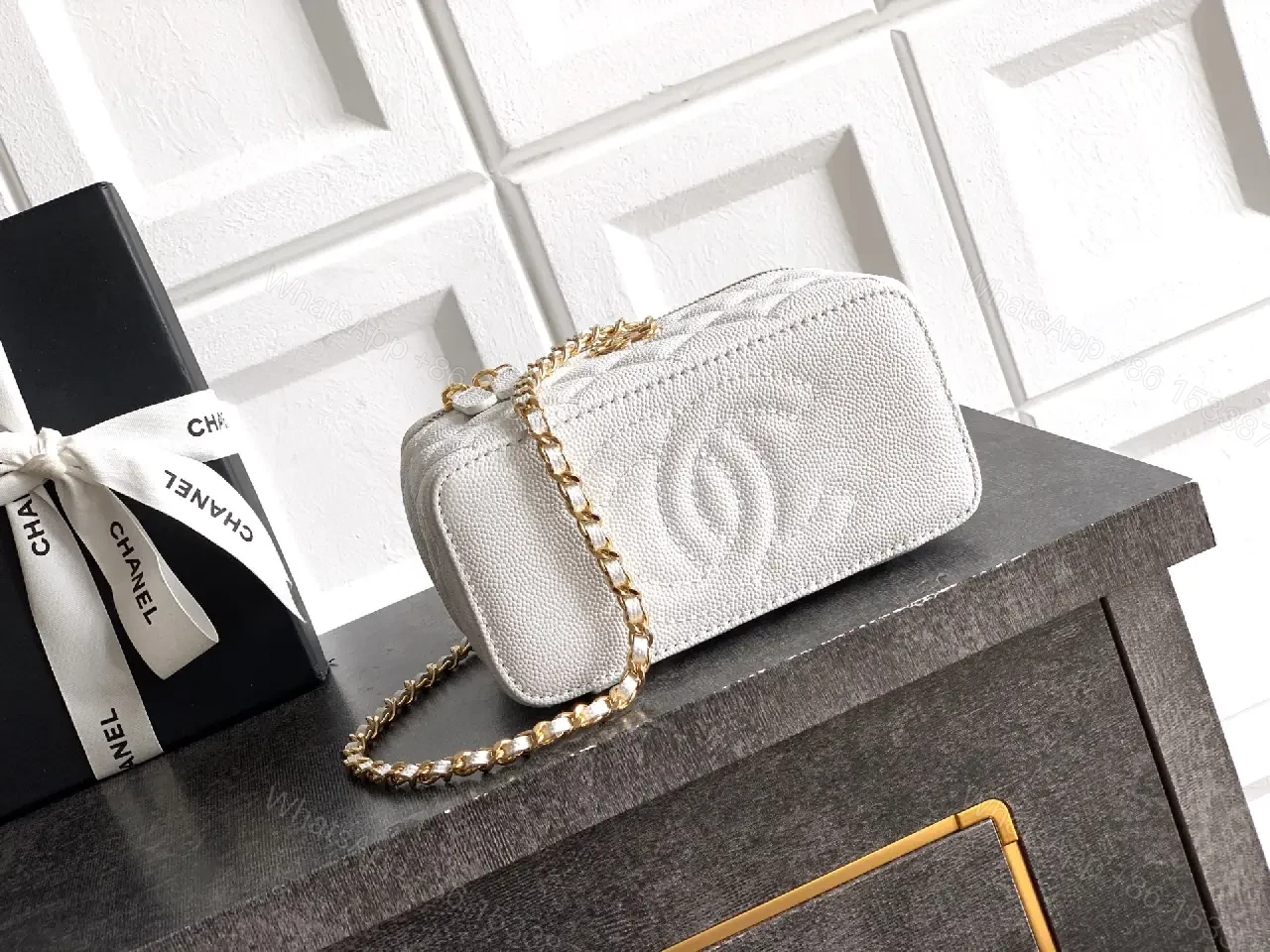 View 2 of white quilted leather bag with chain strap for everyday luxury