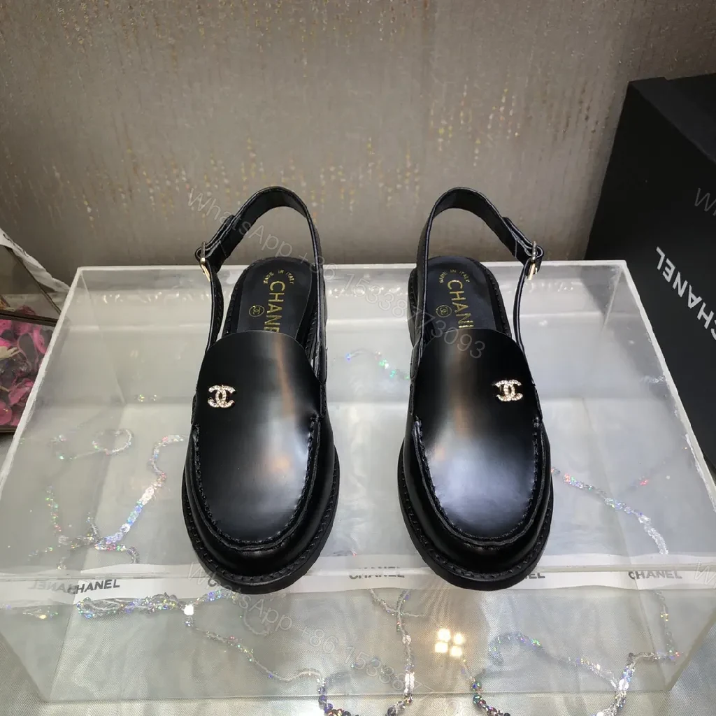 View 4 of Black Leather Mules with Gold Logo Hardware, Minimal Slider Mule