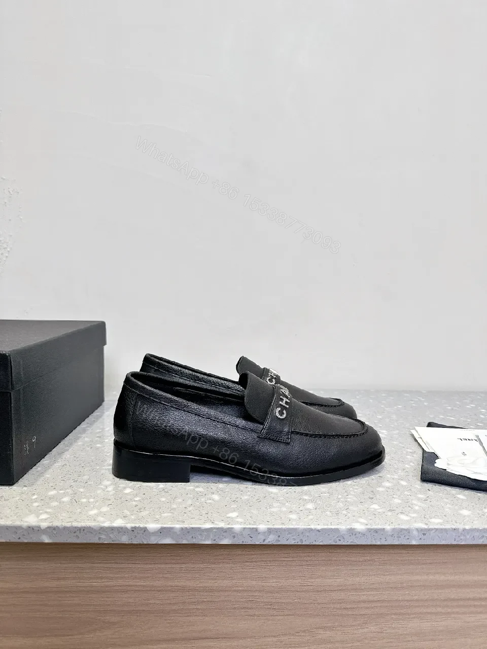 View 6 of Black Leather Slip-On with Logo Strap – Modern Luxe Comfort