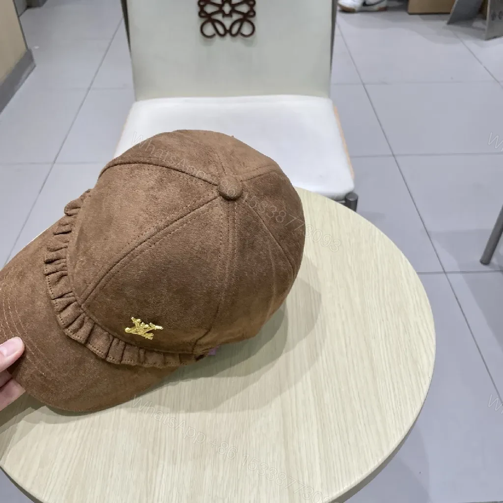 View 6 of Brown Suede Cap with Gold Emblem - Textured Luxury Cap