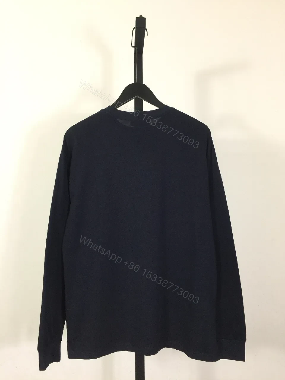 View 9 of Minimalist Navy Cotton Crewneck Sweatshirt with Subtle Logo