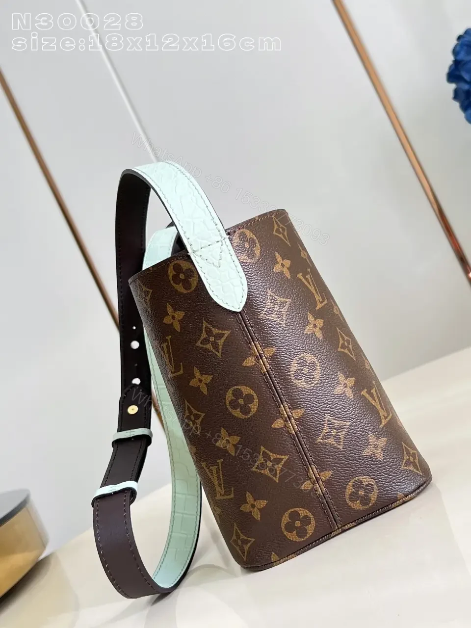 View 4 of Brown Monogram Bucket Bag: Structured Crossbody with Aqua Strap
