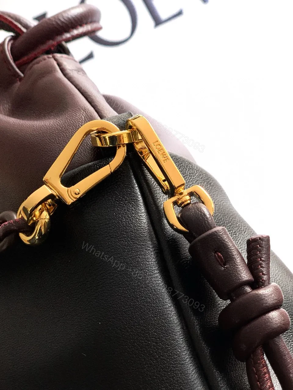 View 9 of Two-Tone Leather Drawstring Bucket Bag with Chain Detail