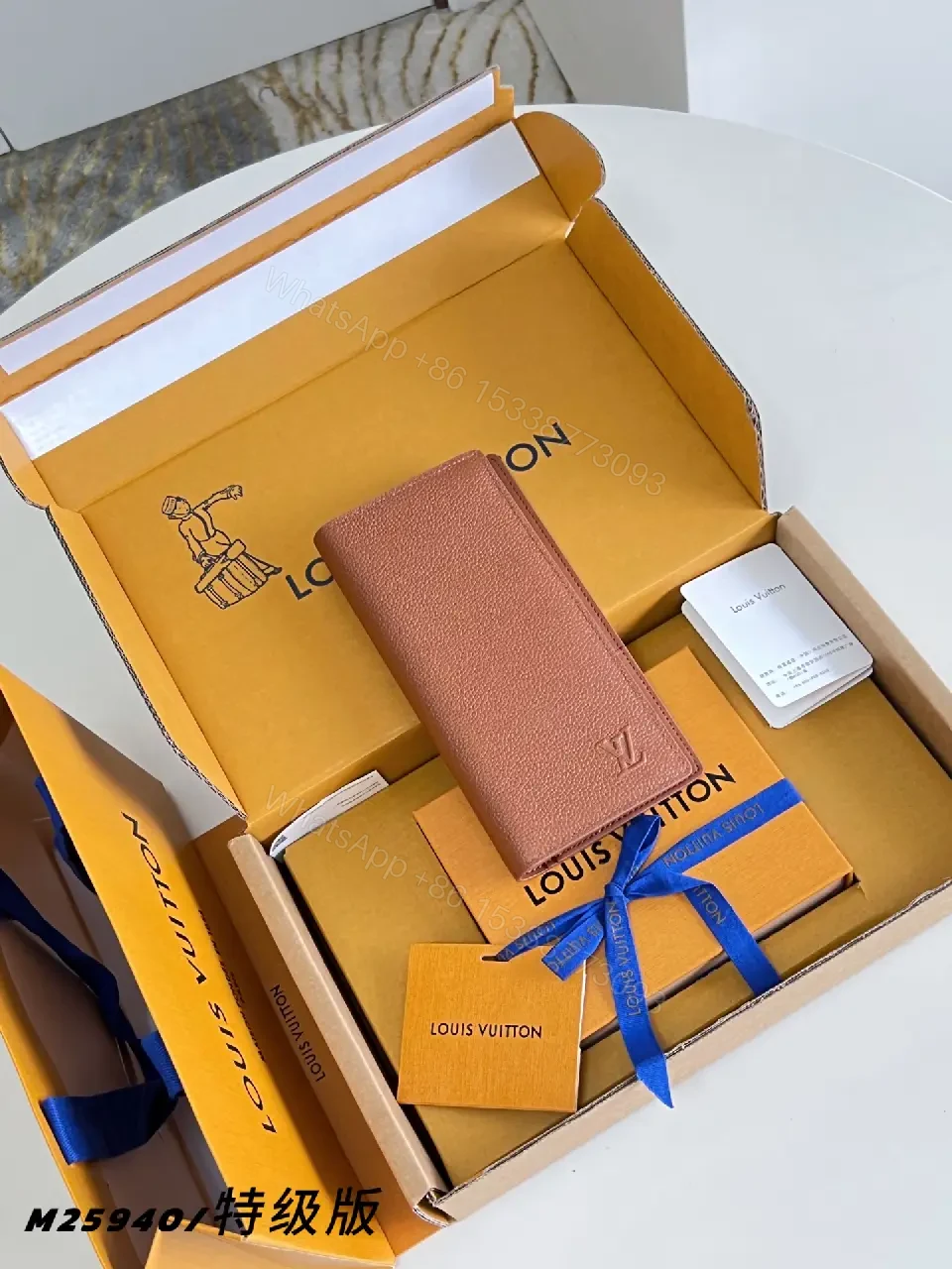 View 4 of Light Brown/Pale Pink Pebbled Leather Bi-Fold Wallet with LV Embossed Logo