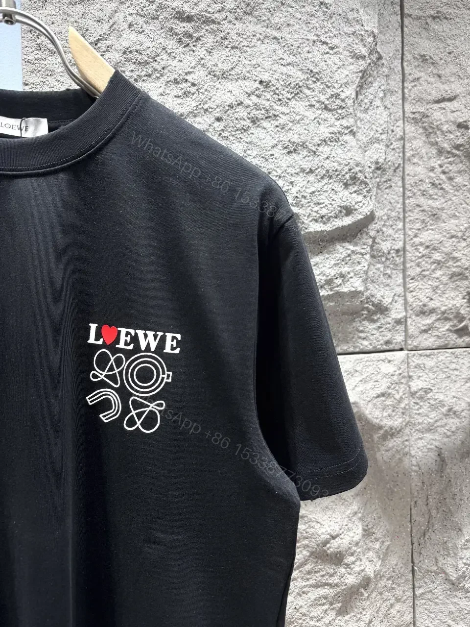 View 7 of Black Cotton Tee with Subtle Embroidered Graphic, Minimal Luxury, Everyday Wear