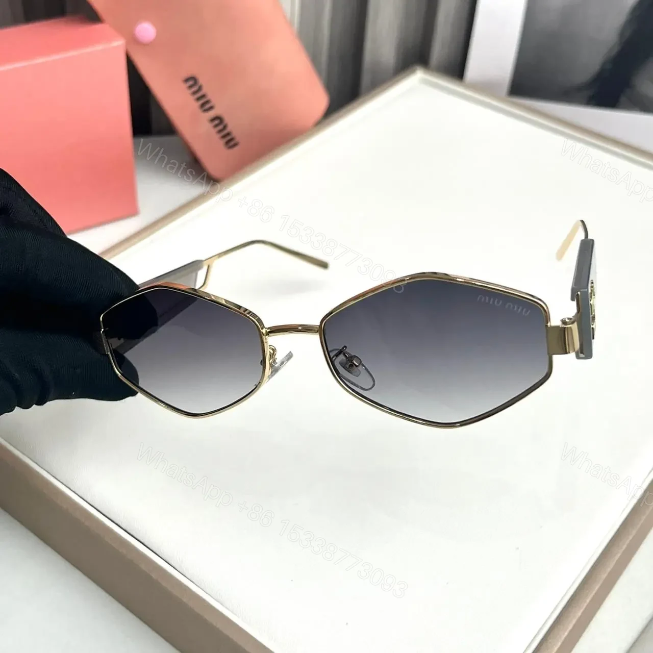 View 2 of Miu Miu Hexagon Grey Sunglasses – One Size – UV Protection