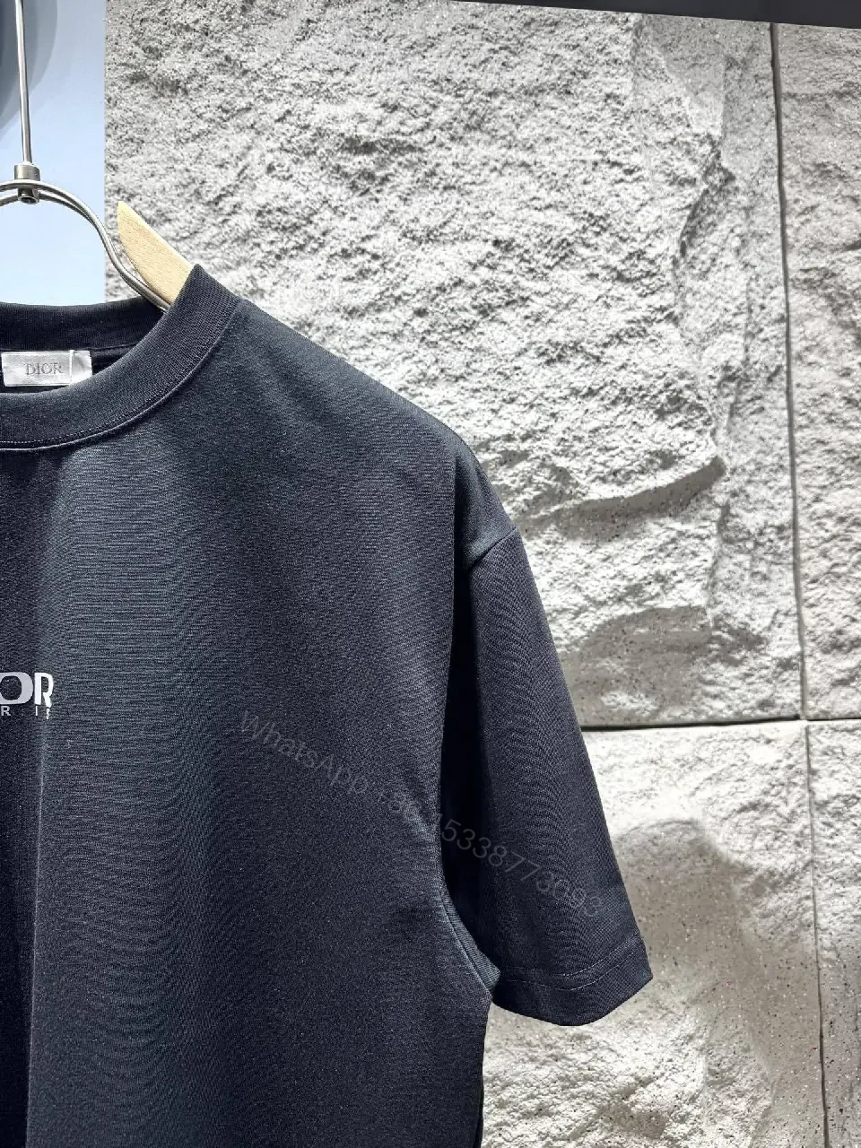 View 7 of Minimalist Black Tee with Subtle Logo – Everyday Luxe Tee