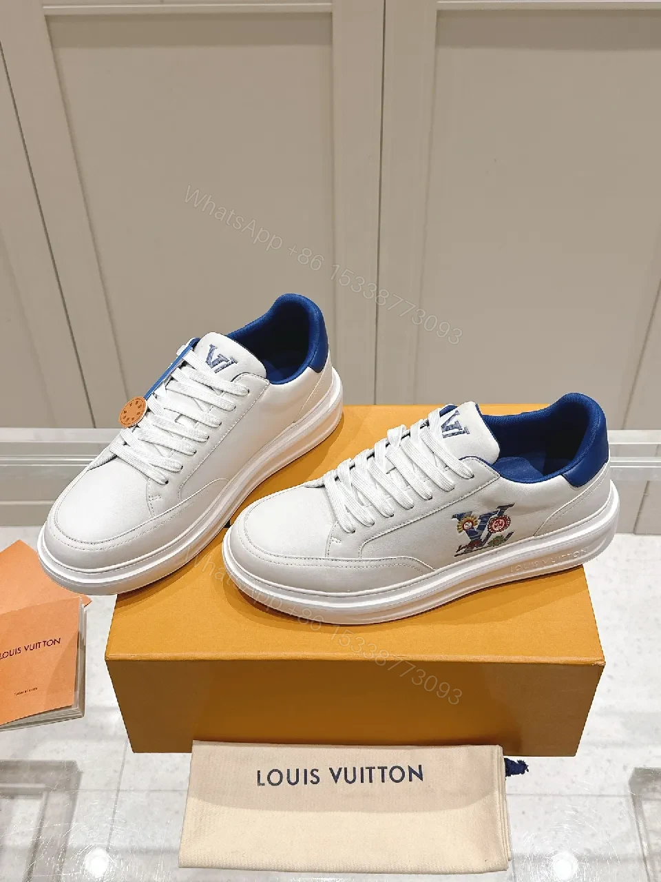 Clean White Leather Low-Top Sneakers with Subtle Designer Embellishments — view 1