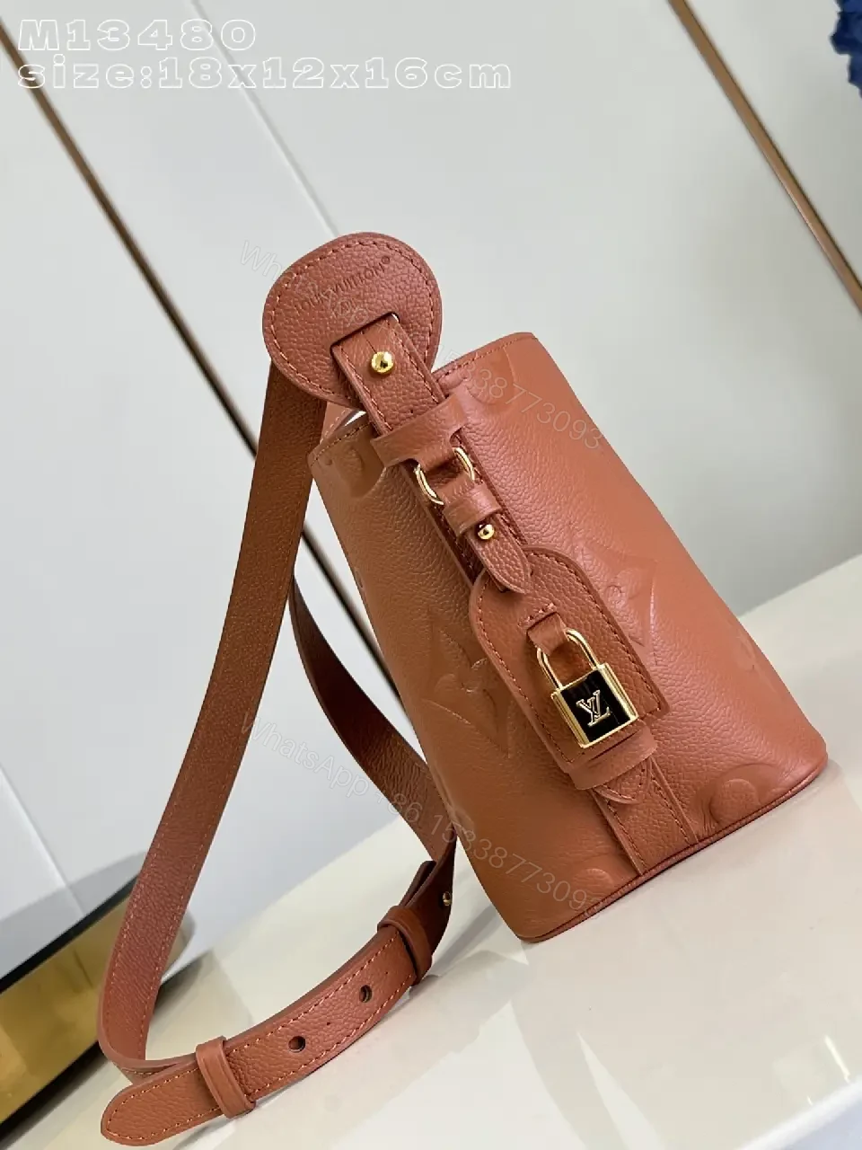 View 3 of Soft-Tone Cropped Bucket Bag with Monogram Embossing Bag