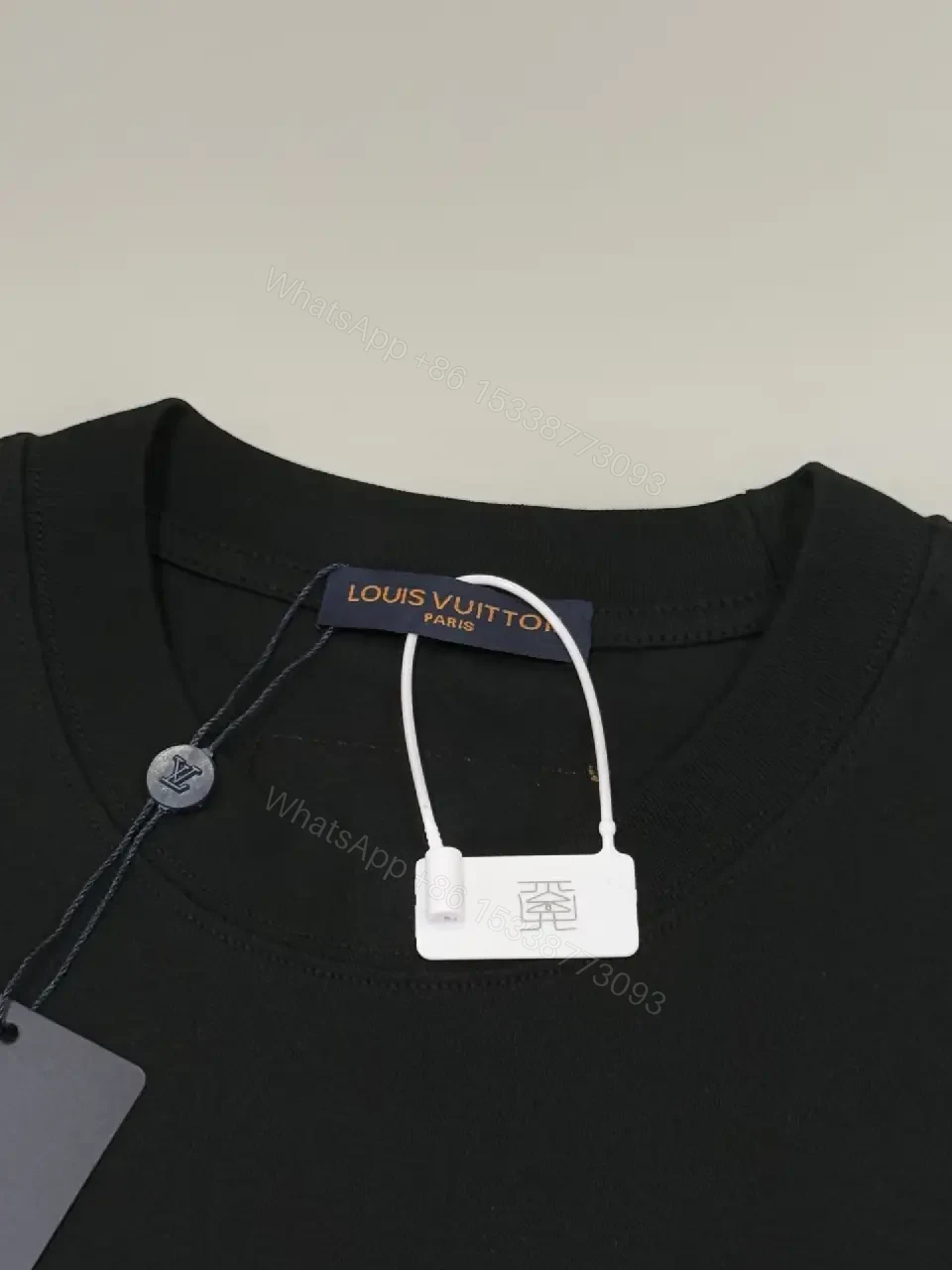 View 10 of Premium Black Tee — Discreet Logo, Soft Cotton Blend, Structured Fit