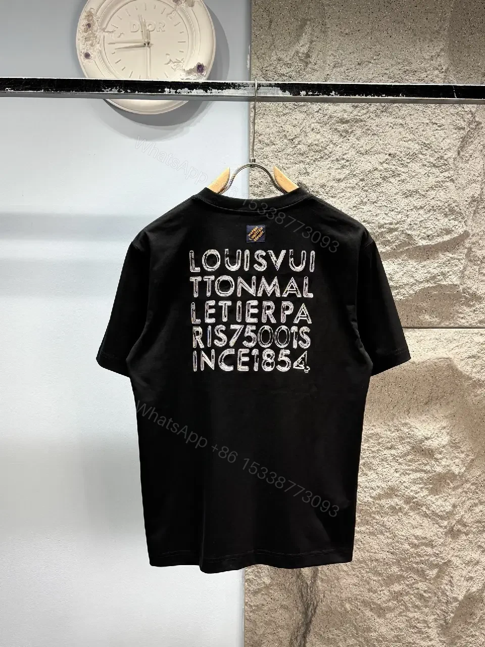View 10 of Minimalist Black Cotton Tee with Subtle LV.M Logo
