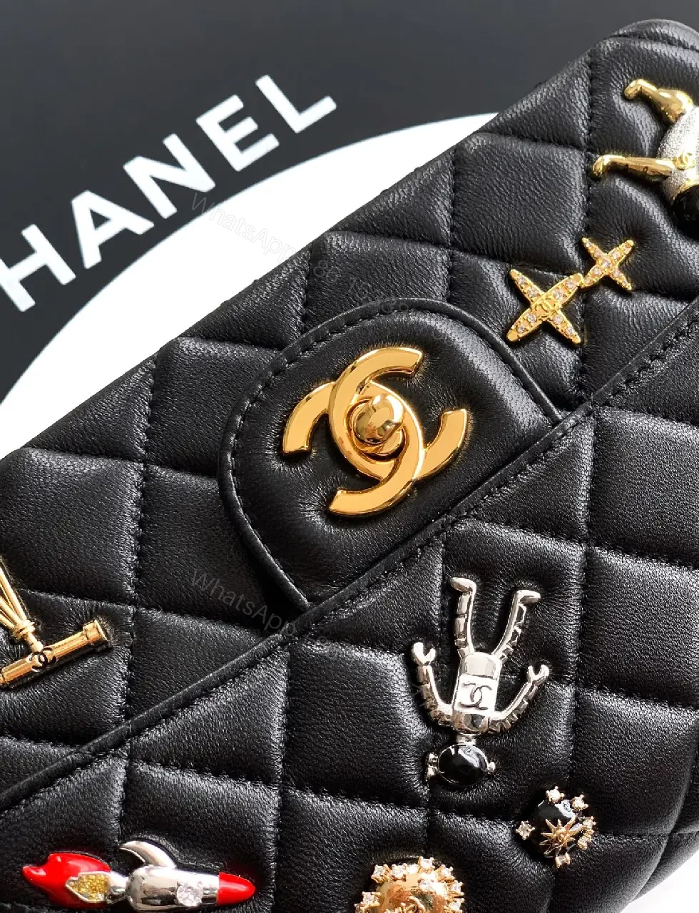 View 7 of Quilted Black Leather Crossbody: Golden Turn-Lock Charm Bag