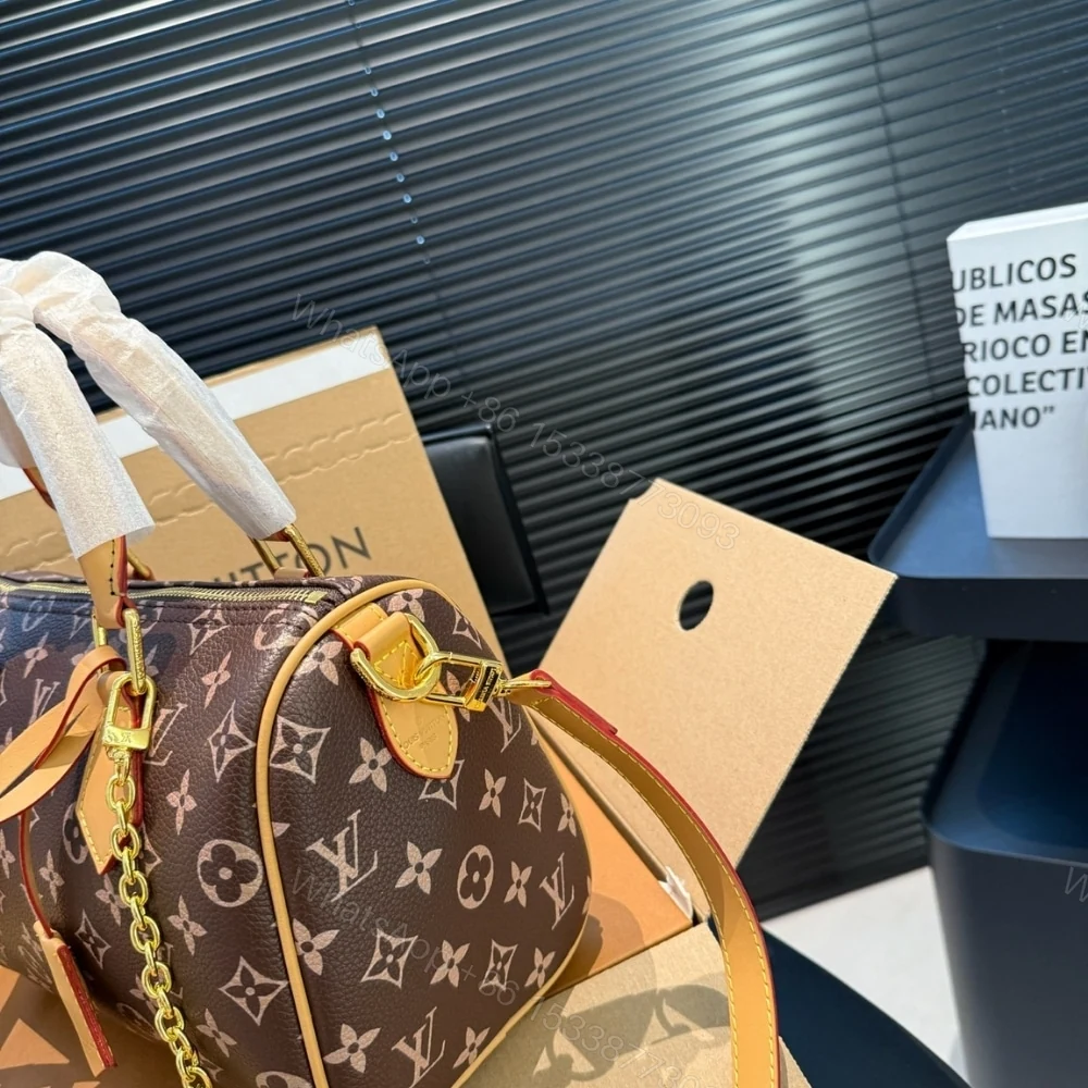 View 5 of LOUIS VUITTON SPEEDY P9 BANDOULIÈRE 25 MONOGRAM BROWN 25CM M24443