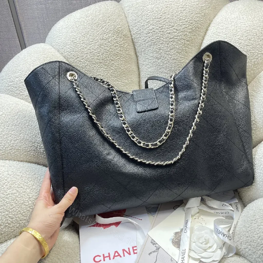 View 3 of Black Quilted Leather Shoulder Bag with Chain Straps and Chanel Logo