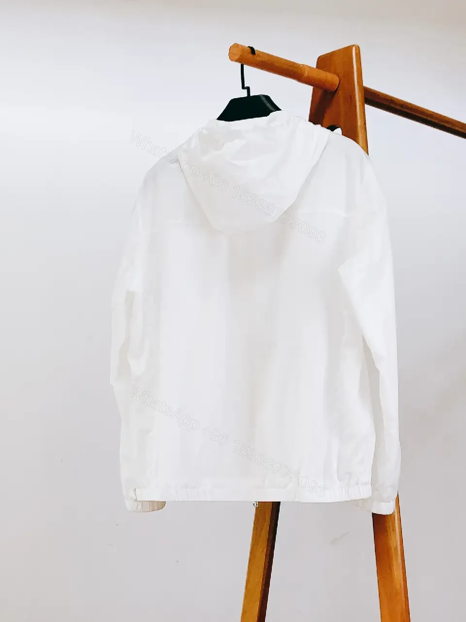 View 3 of White Nylon Windbreaker with Red Accent — Lightweight, Weather-Ready Outerwear