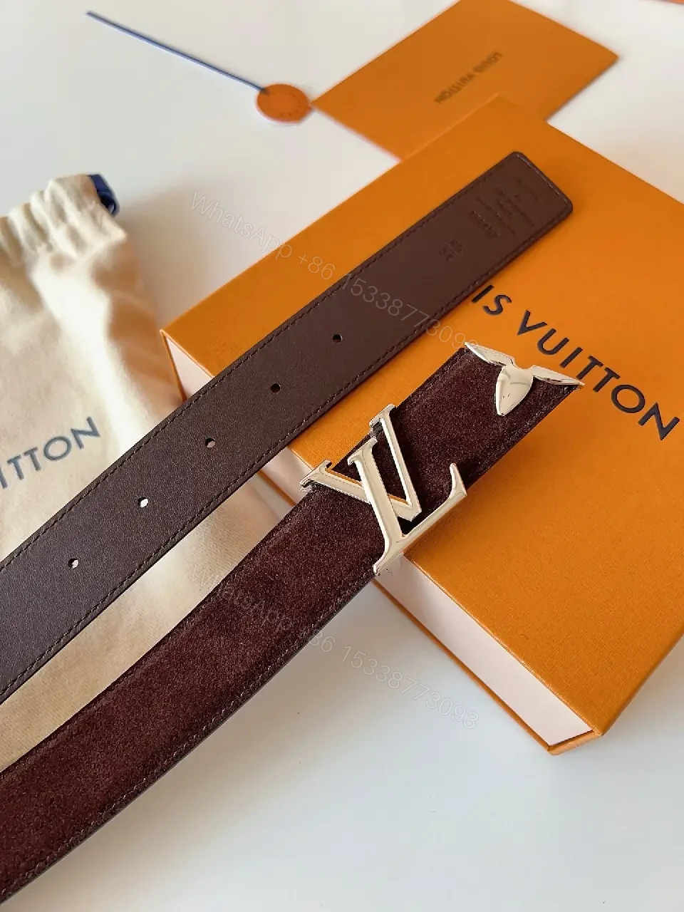 View 6 of Textured Leather Belt with Gold LV Buckle - Luxury Accessory Belt