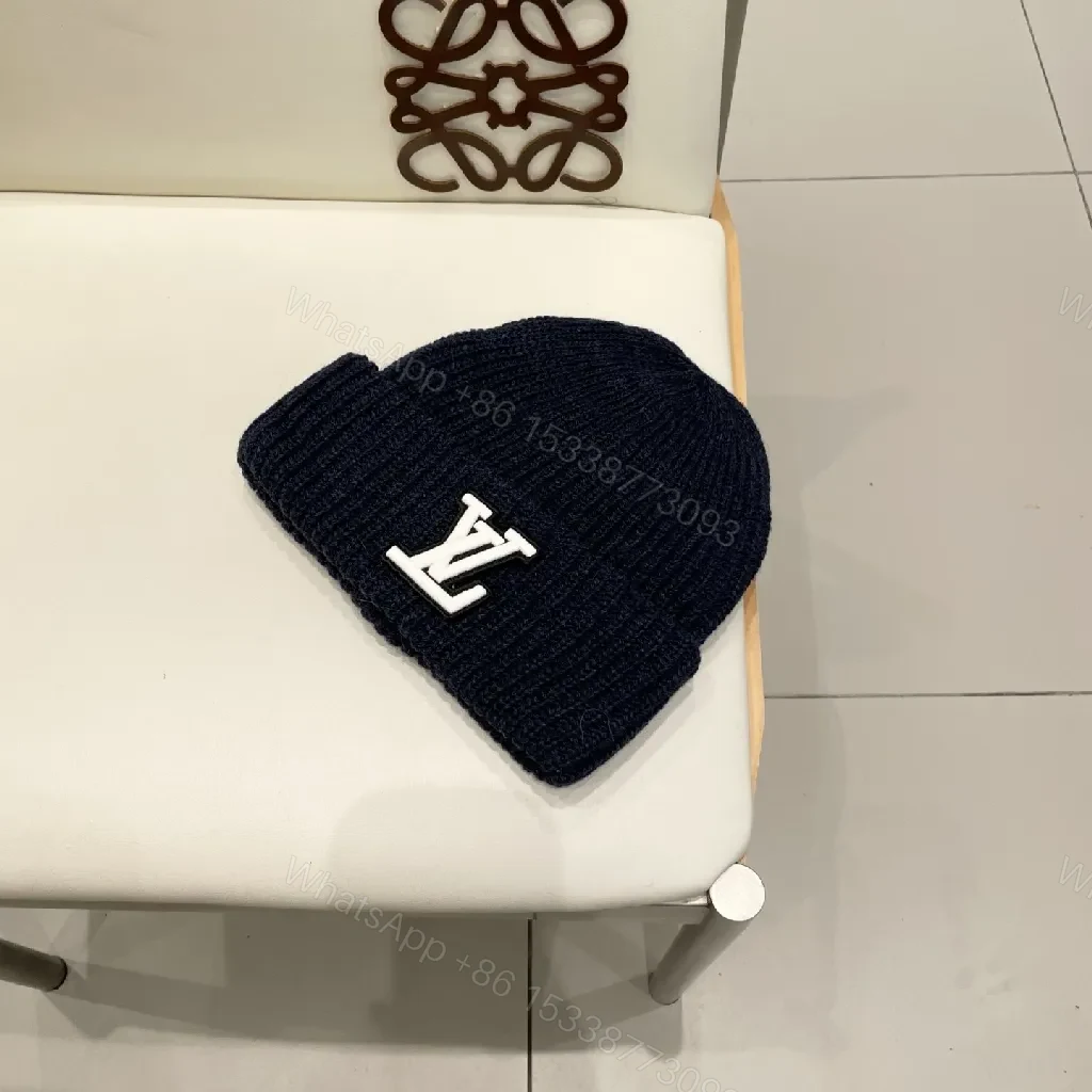 View 2 of Cozy Black Knit Beanie with Subtle Emblem Detail
