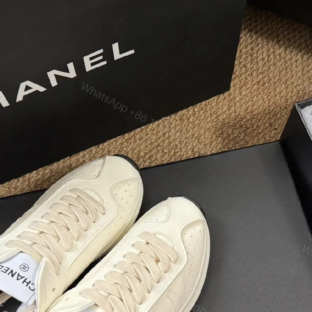 View 2 of White Leather Sneakers - Subtle Texture, Everyday Luxury